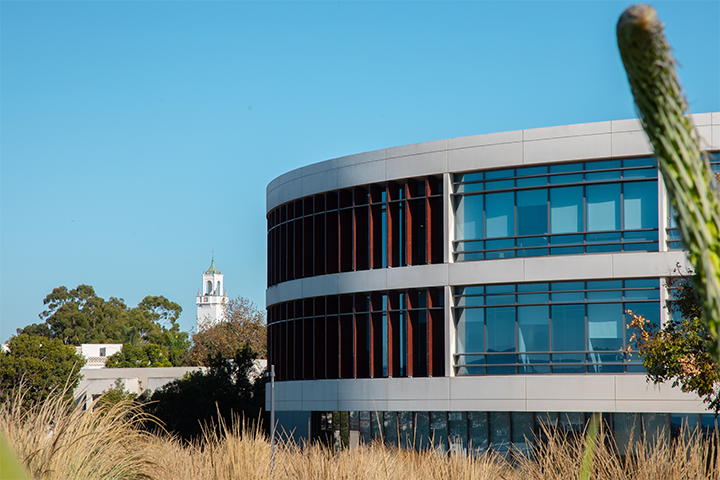 A section of Hannon Library with the clock tower in the background.
